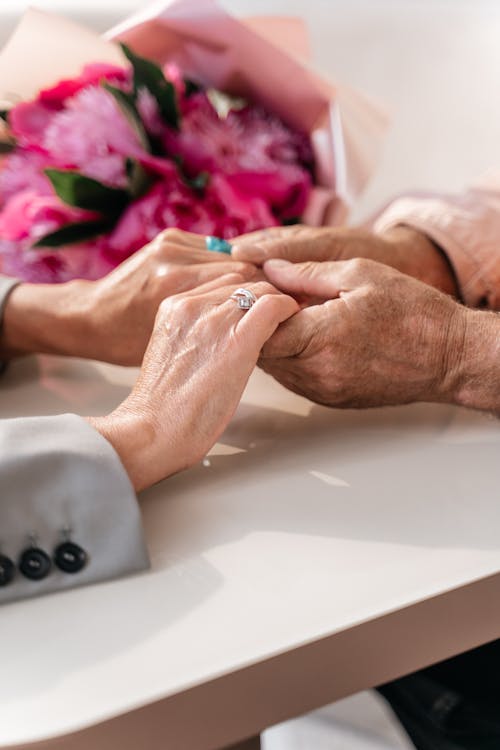 Gentle hand-holding showing comfort and connection in memory care