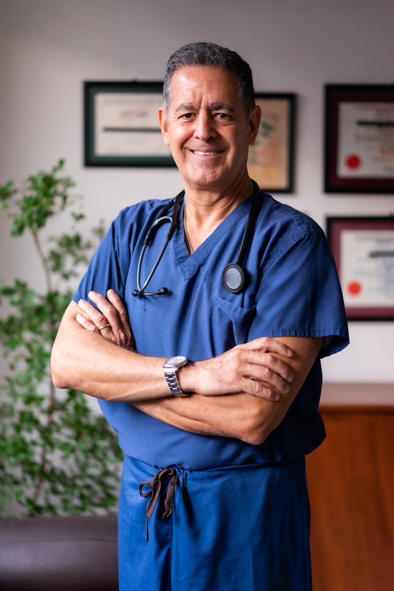 Caregiver assisting with bed transfer — an IHSS-qualifying personal care service
