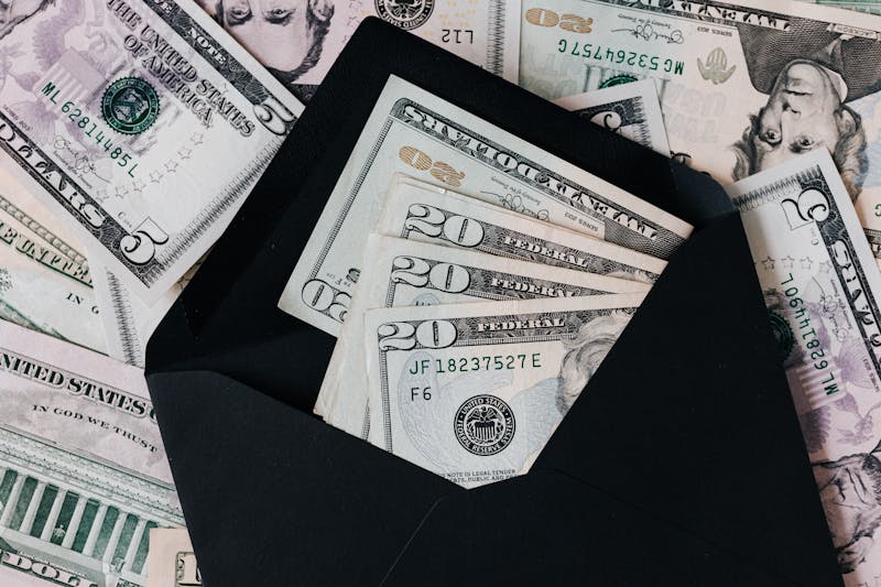 A person organizing financial documents in folders at home