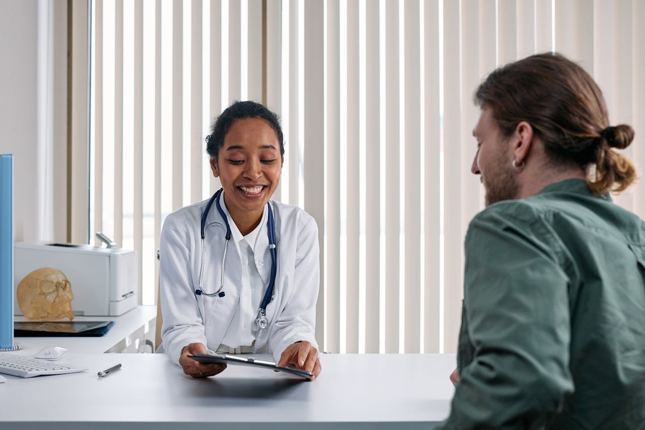Healthcare professional reviewing documents, representing the evolution of medical care and health coverage programs
