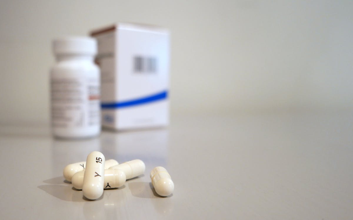 Stack of medical billing documents and insurance claim forms used in Medicare fraud schemes