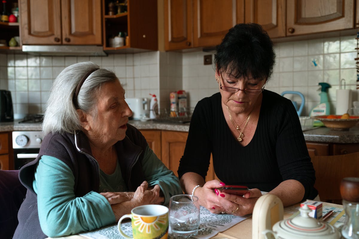 Home caregiver assisting Orange County senior with meal preparation under CalAIM Community Supports