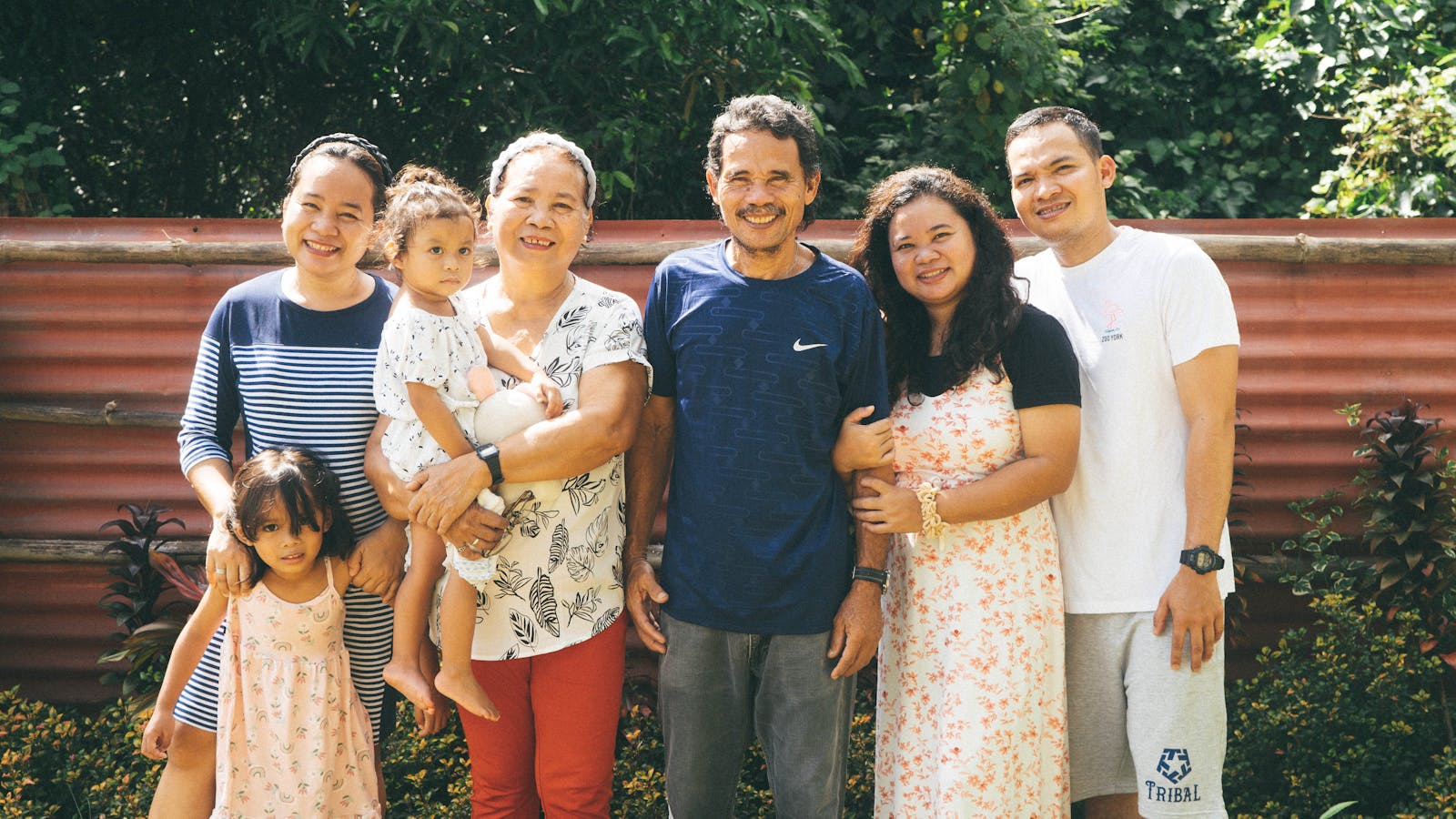 Orange County multigenerational family enjoying time together in garden — sandwich generation finding balance
