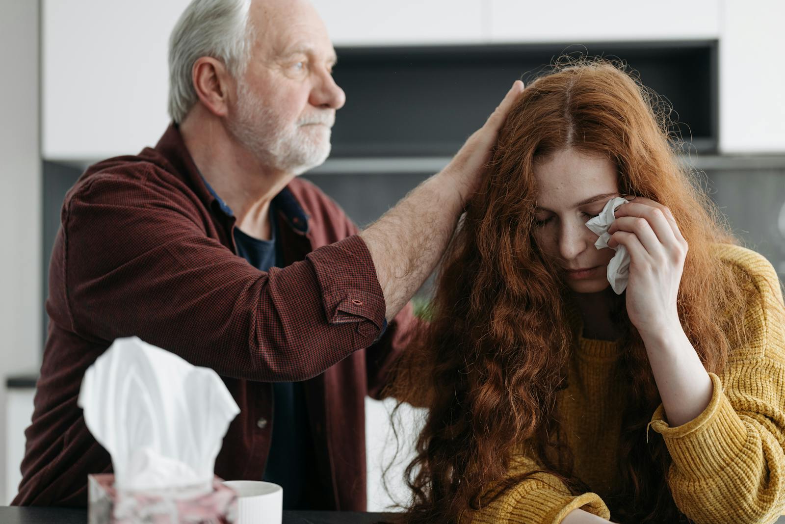 Adult daughter receiving emotional support in Orange County family home