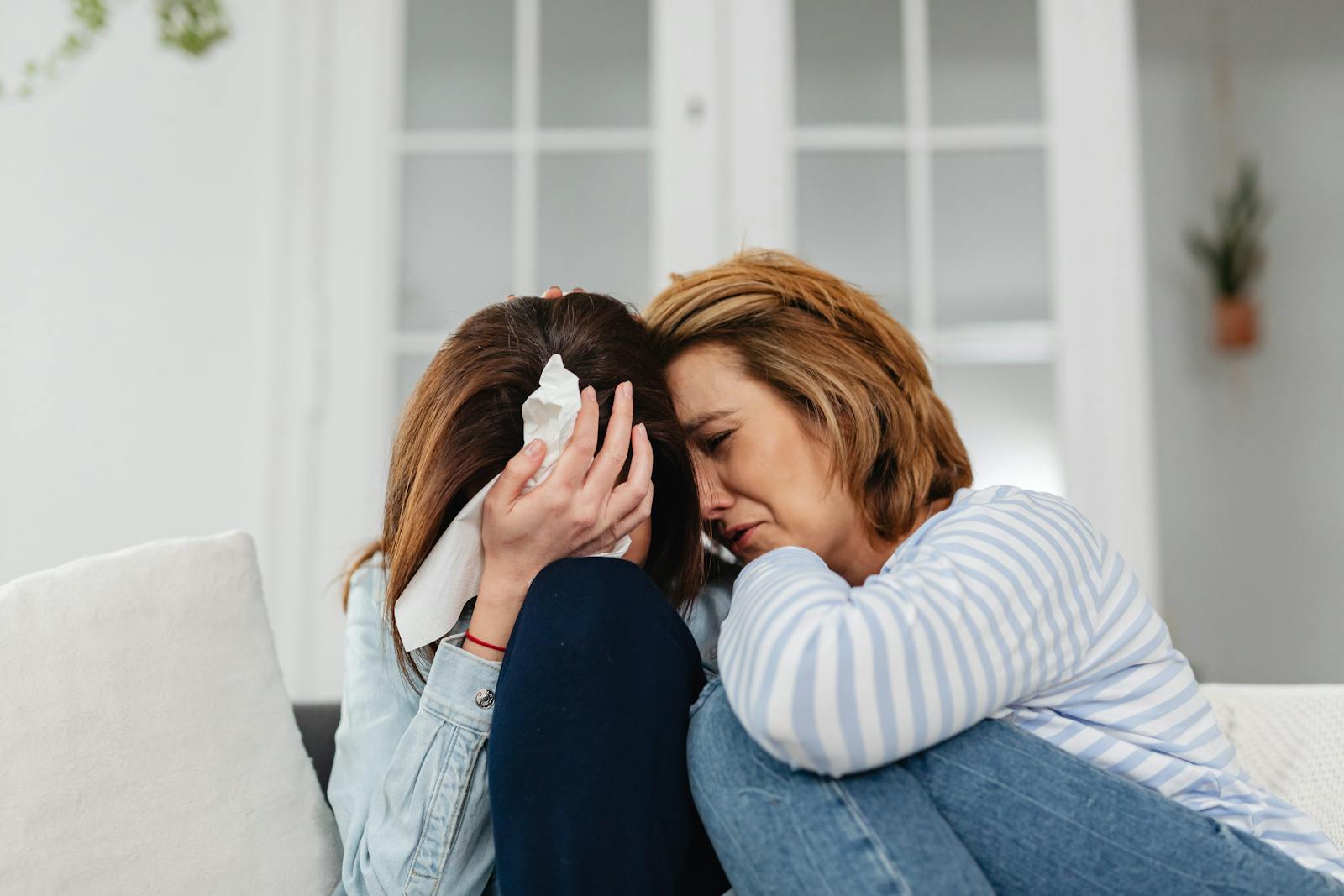 Two Orange County friends sharing a moment of emotional support