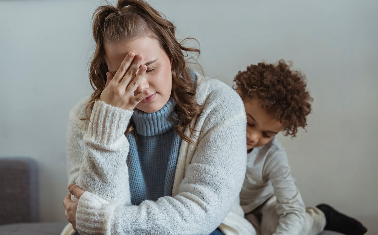 OC family caregiver showing signs of exhaustion and stress at home