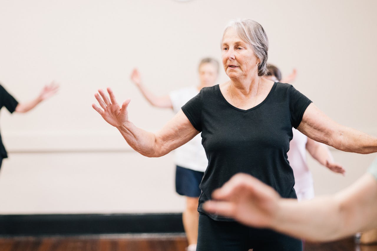 Group of older women participating in a dance fitness class together