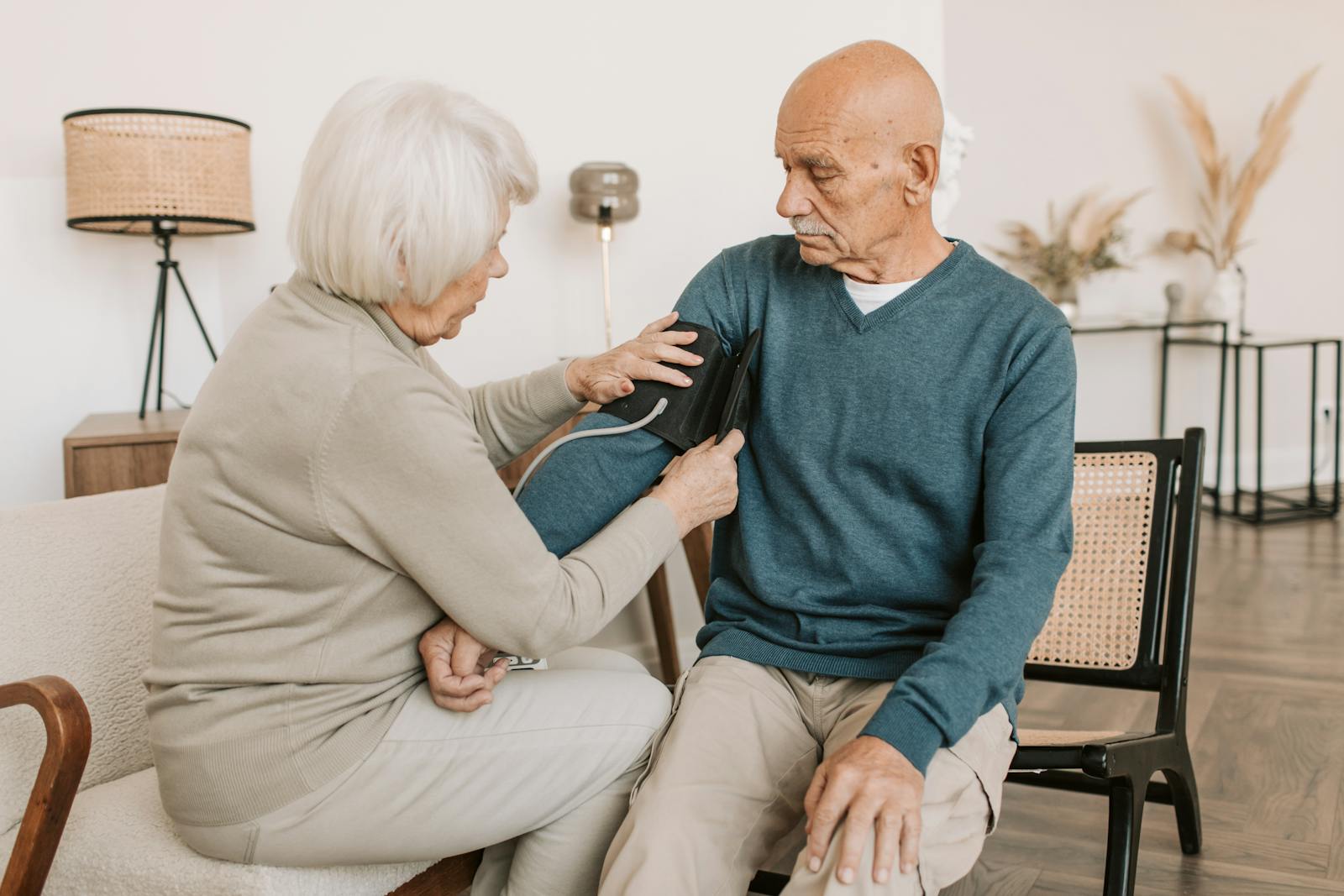 Elderly couple monitoring blood pressure at home during May 2026 OC heat wave