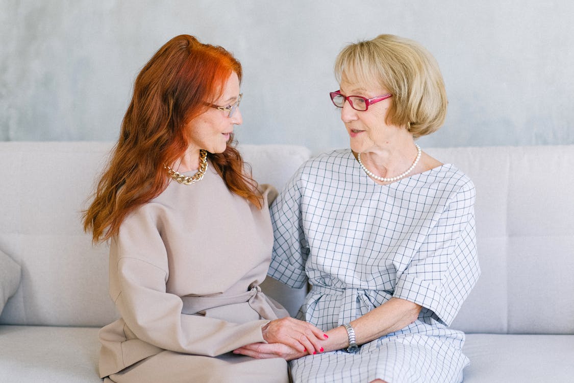 Family caregiver and elderly parent reviewing care contingency plan together