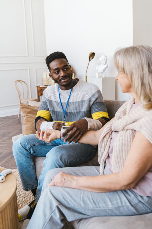Social worker consulting with senior woman about home care options in Orange County