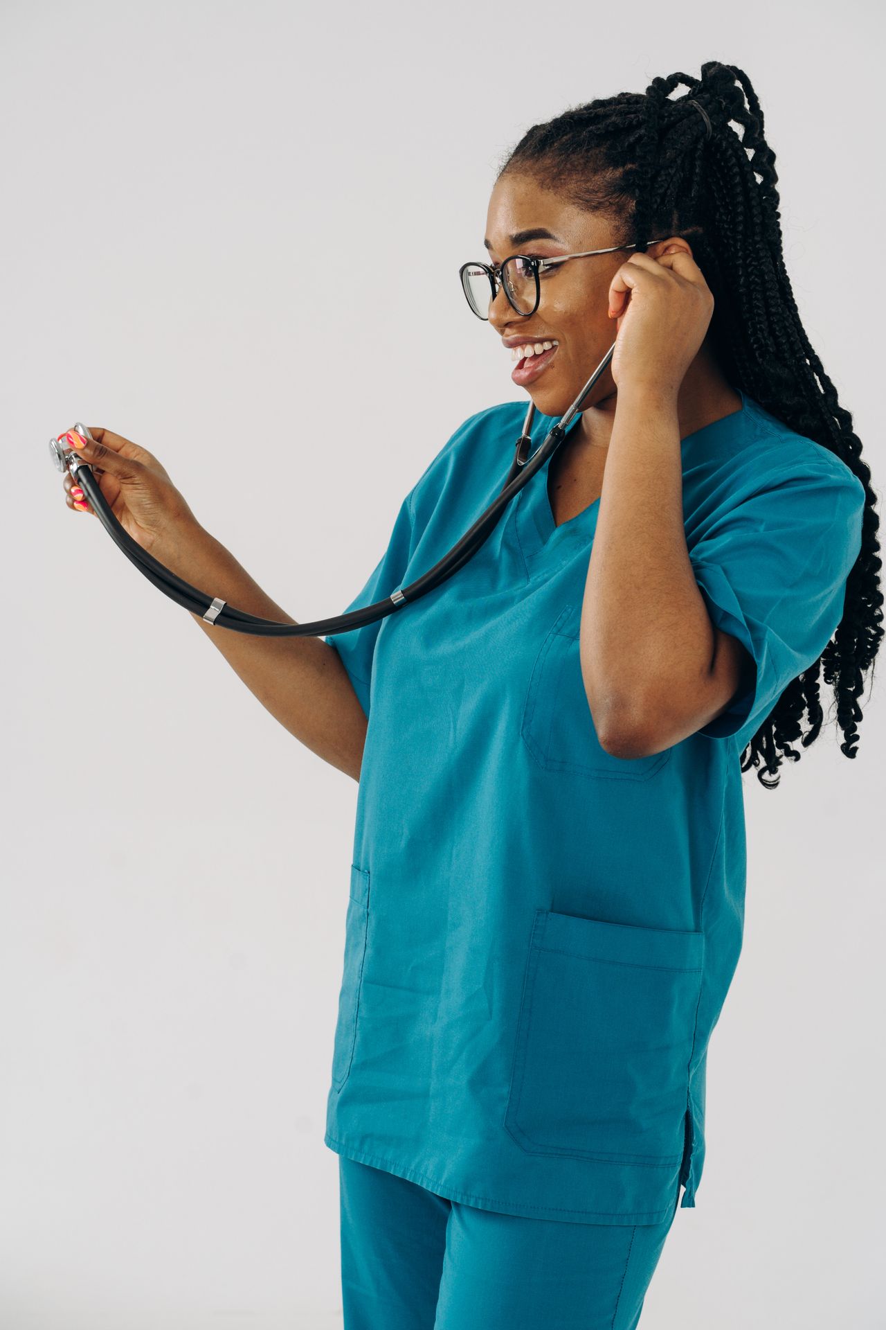 Professional nurse with stethoscope in teal scrubs representing the OC caregiver labor market