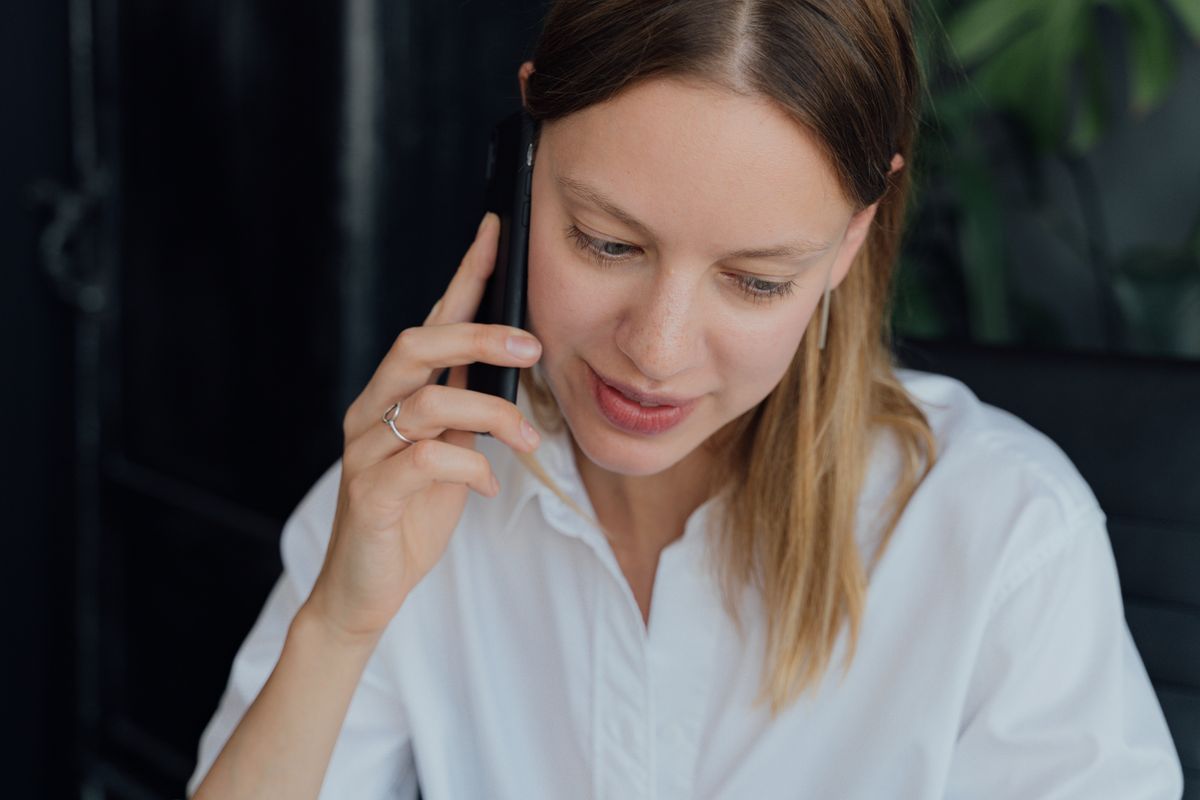 Woman on a phone call arranging care for a parent